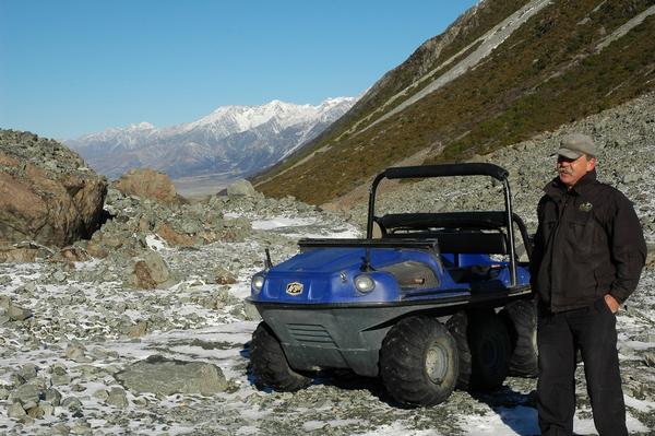 Tasman Valley 4WD & Argo tour guide Graeme Slatter with an argo overlooking the Tasman Valley